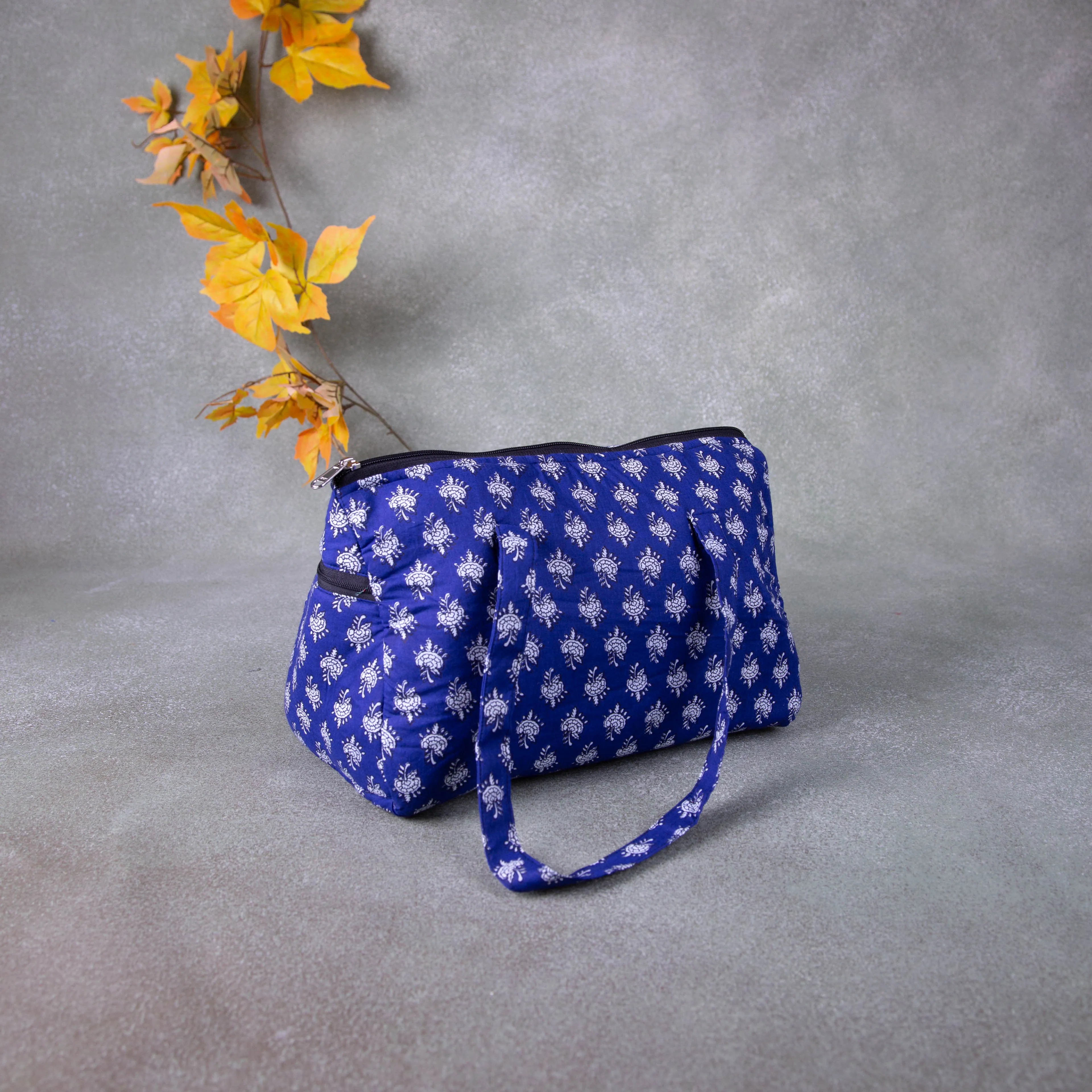 Barrel Handbags Blue Colour with Small Grey Colour Flower Design.